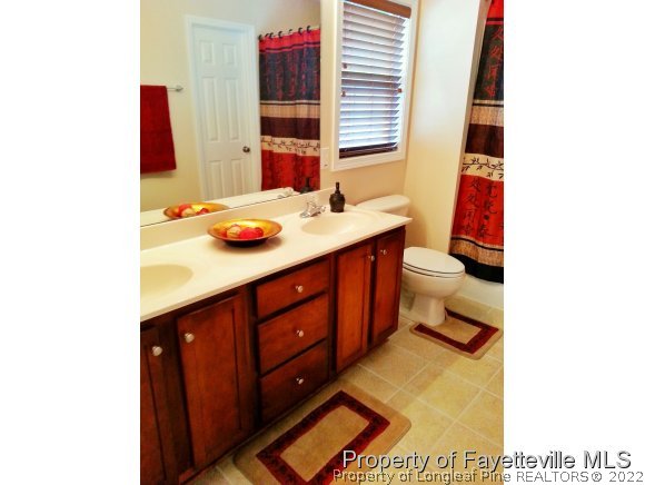 75 Holly Oak Circle Bunnlevel, NC 28323 - Photo 14 of 25 a bathroom with a sink and a toilet