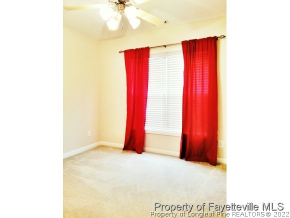 75 Holly Oak Circle Bunnlevel, NC 28323 - Photo 15 of 25 a view of a room with a window and a flat screen tv