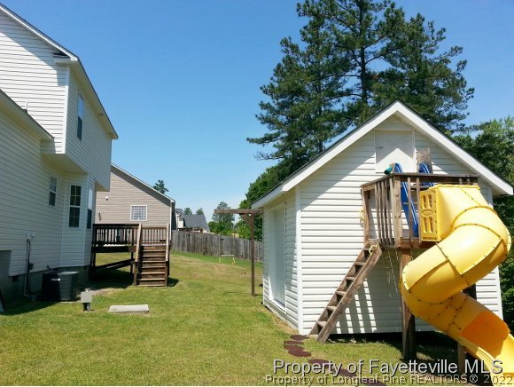 75 Holly Oak Circle Bunnlevel, NC 28323 - Photo 18 of 25 a view of a house with a yard