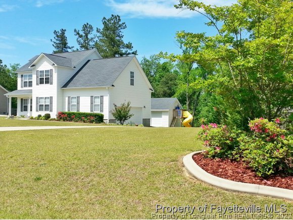 75 Holly Oak Circle Bunnlevel, NC 28323 - Photo 25 of 25 a view of a house with a yard