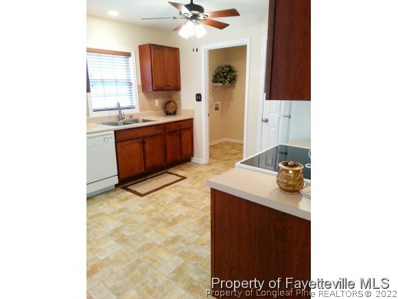 75 Holly Oak Circle Bunnlevel, NC 28323 - Photo 3 of 25 a bathroom with a sink a mirror and a bathtub