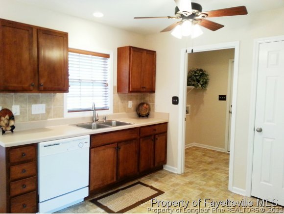 75 Holly Oak Circle Bunnlevel, NC 28323 - Photo 5 of 25 a spacious bathroom with a sink a mirror and a shower