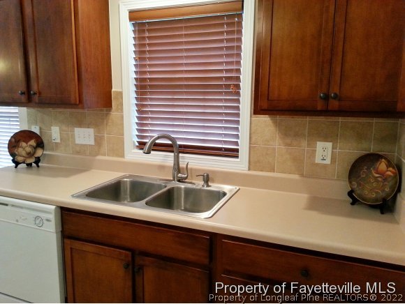 75 Holly Oak Circle Bunnlevel, NC 28323 - Photo 6 of 25 a kitchen with a sink and cabinets