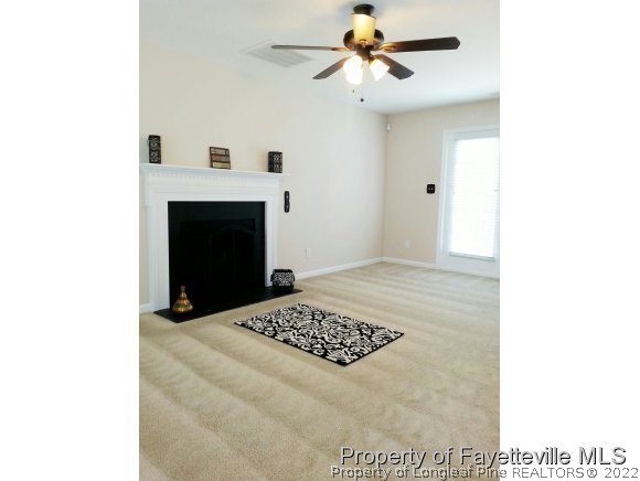 75 Holly Oak Circle Bunnlevel, NC 28323 - Photo 9 of 25 a view of a livingroom with a fireplace