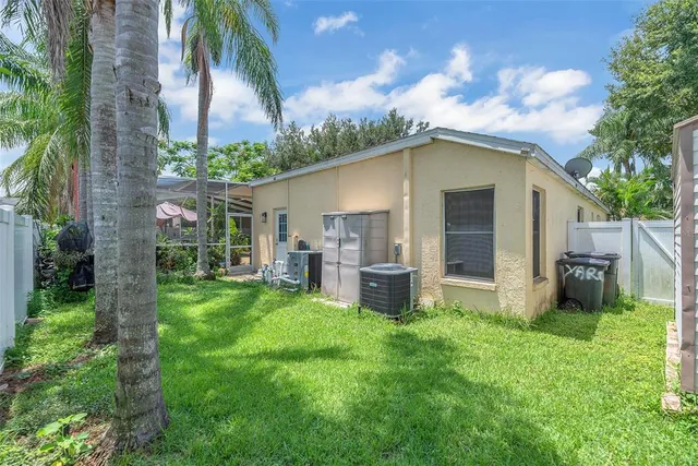 a front view of house with yard and outdoor seating