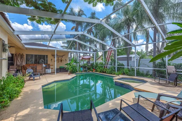 a view of a swimming pool with a patio