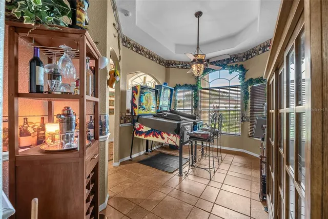 a dining room with furniture and a chandelier