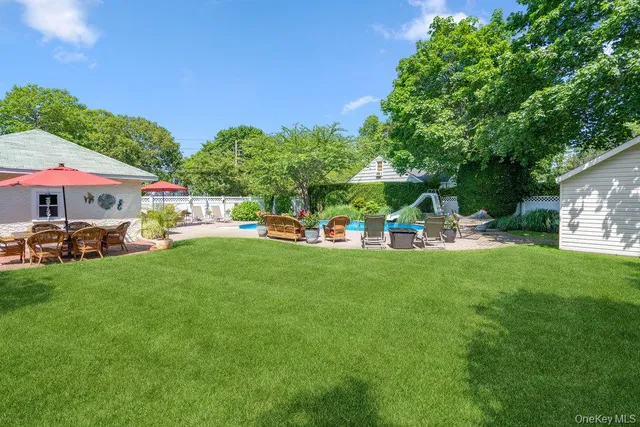 a view of a house with a yard porch and sitting area