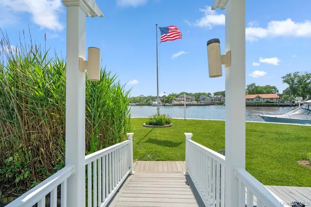 a view of a two dinning table and chairs in the garden