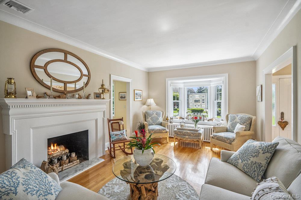 1 Bayview Avenue Islip, NY 11751 - Photo 3 of 18 a living room with furniture a fireplace a window and a fireplace