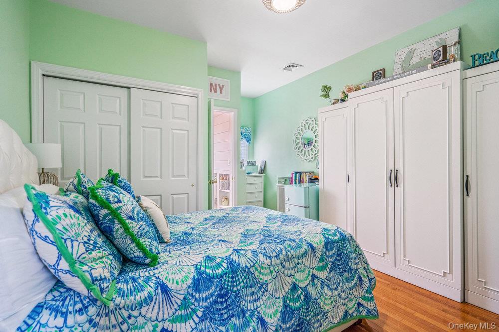 1 Bayview Avenue Islip, NY 11751 - Photo 10 of 18 a bedroom with a bed and a window