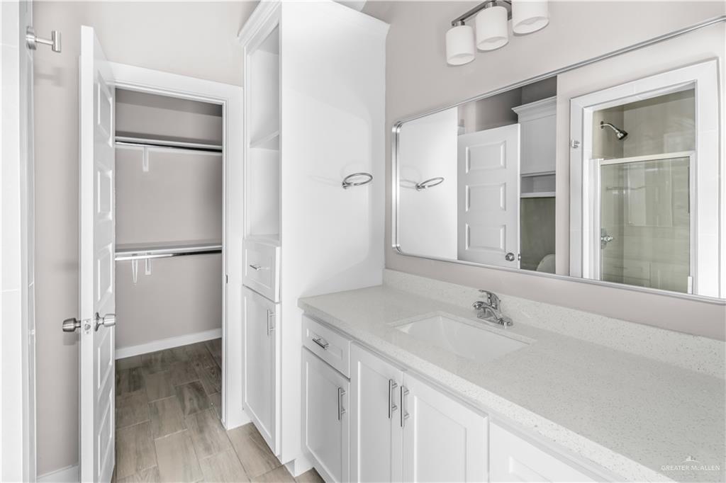 3186 Briggs Road, Unit 1 Weslaco, TX 78596 - Photo 10 of 13 a bathroom with a sink and a mirror
