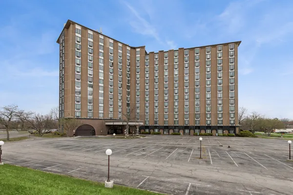 a view of a building with a yard