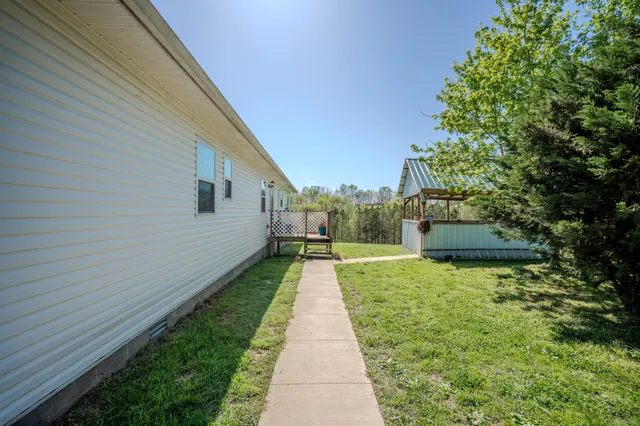 a view of a backyard of the house
