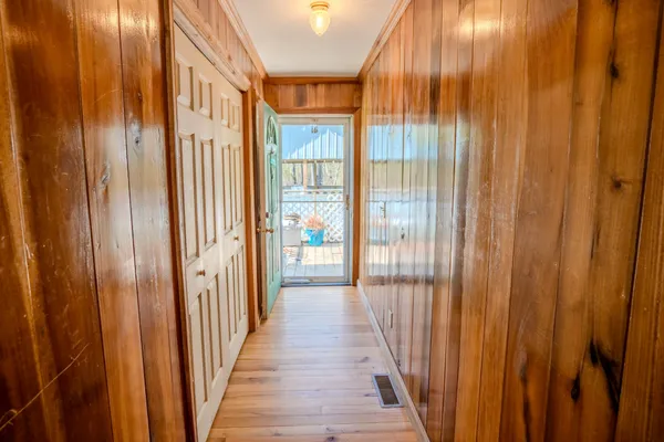 a view of a wooden floor and a door