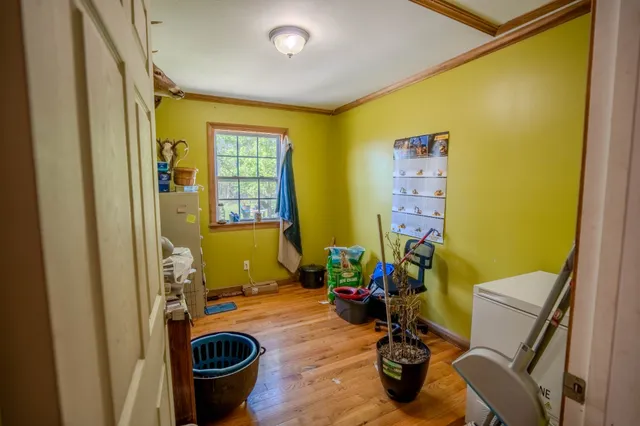 a view of a dining room with furniture and a window