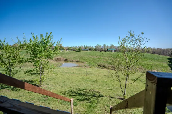 a view of a lake with a yard