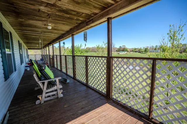 a chair and table in wooden deck