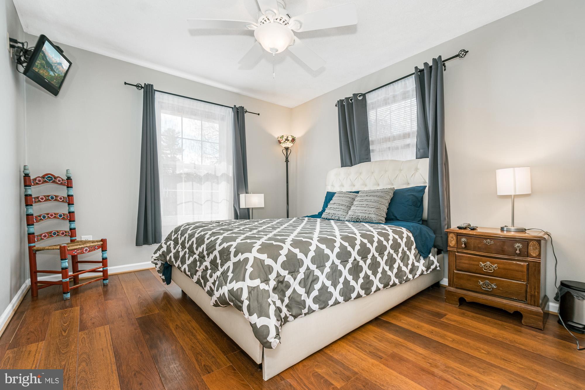390 Glen Cove Road Swanton, MD 21561 - Photo 54 of 73 a bedroom with a bed and wooden floor