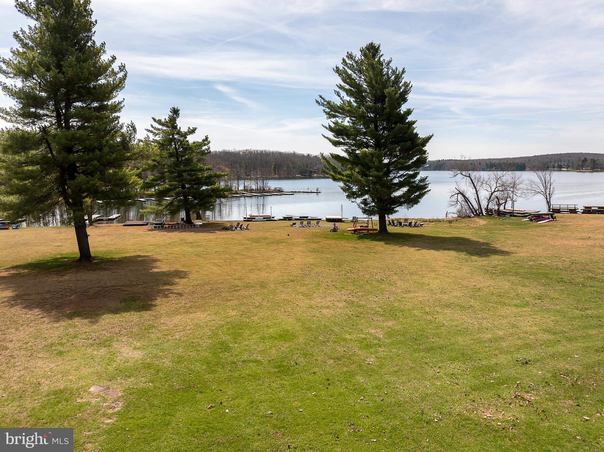 390 Glen Cove Road Swanton, MD 21561 - Photo 70 of 73 a view of a lake with a building in the background