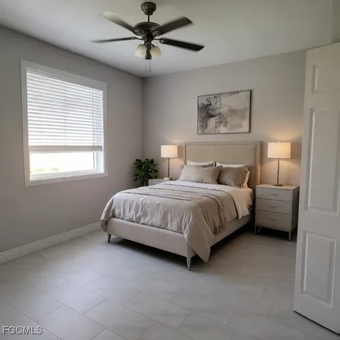 a bedroom with a bed a ceiling fan and a window