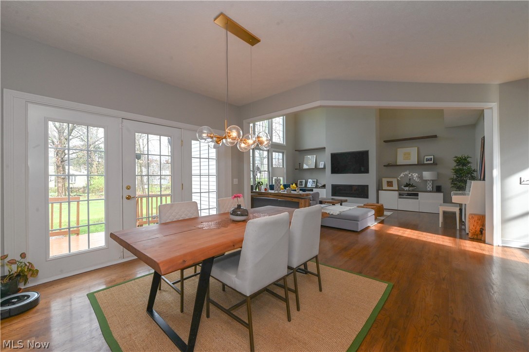1688 Sheridan Road South Euclid, OH 44121 - Photo 9 of 48 Dining space with light hardwood / wood-style flooring, french doors, a notable chandelier, and lofted ceiling