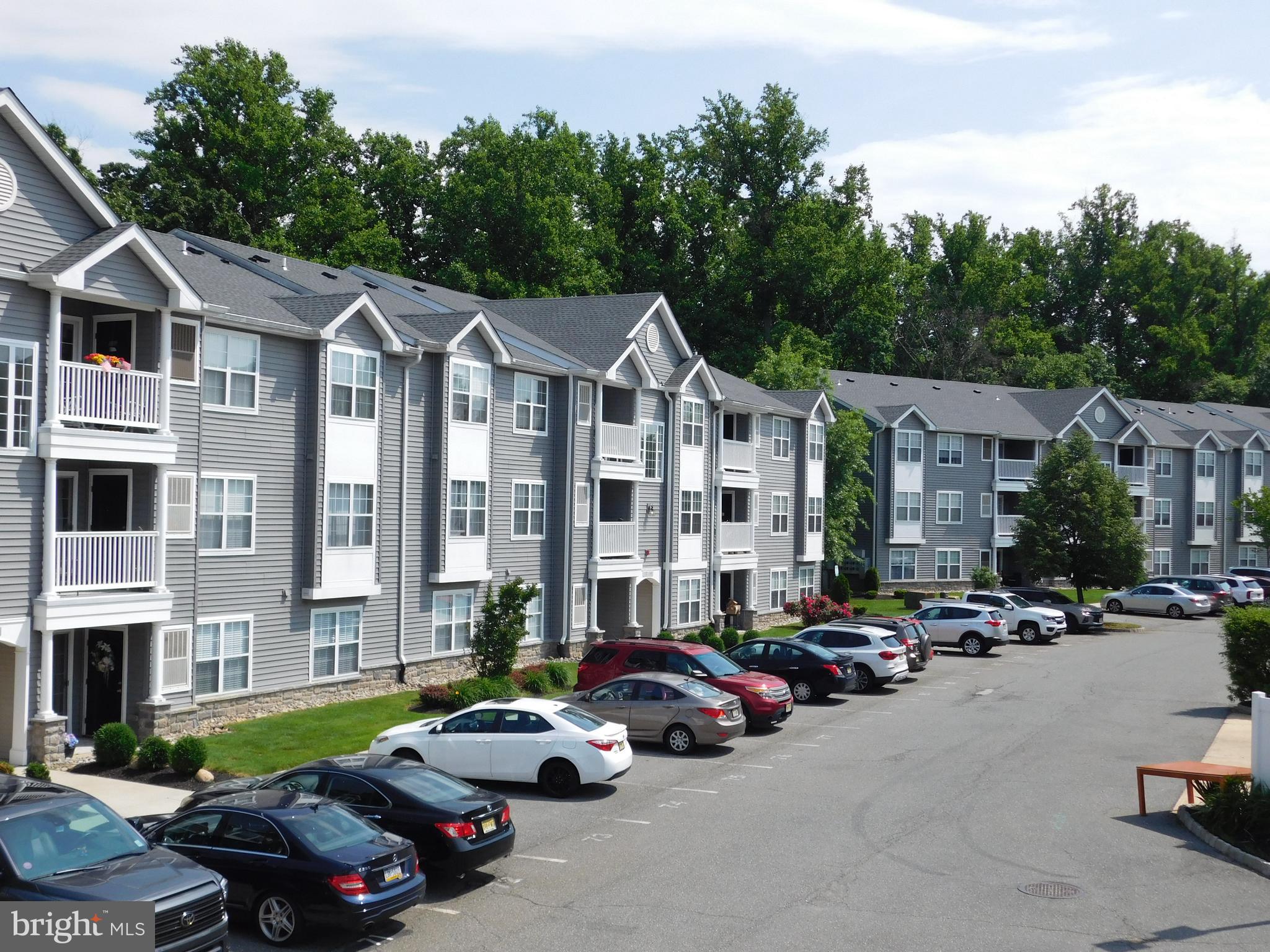 a street view with cars and buildings