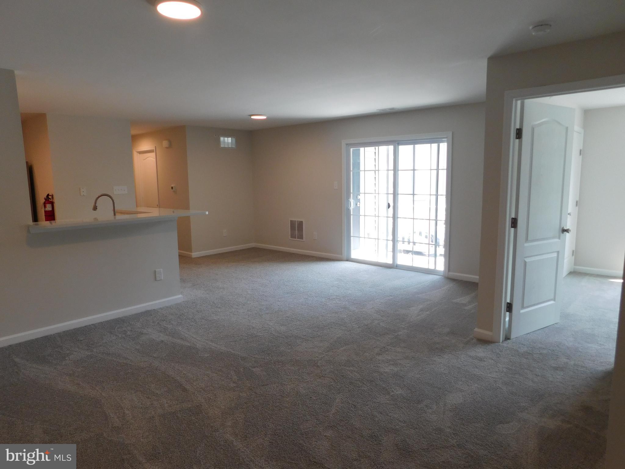 165 Natalie Road Delran, NJ 08075 - Photo 5 of 16 a view of empty room with windows