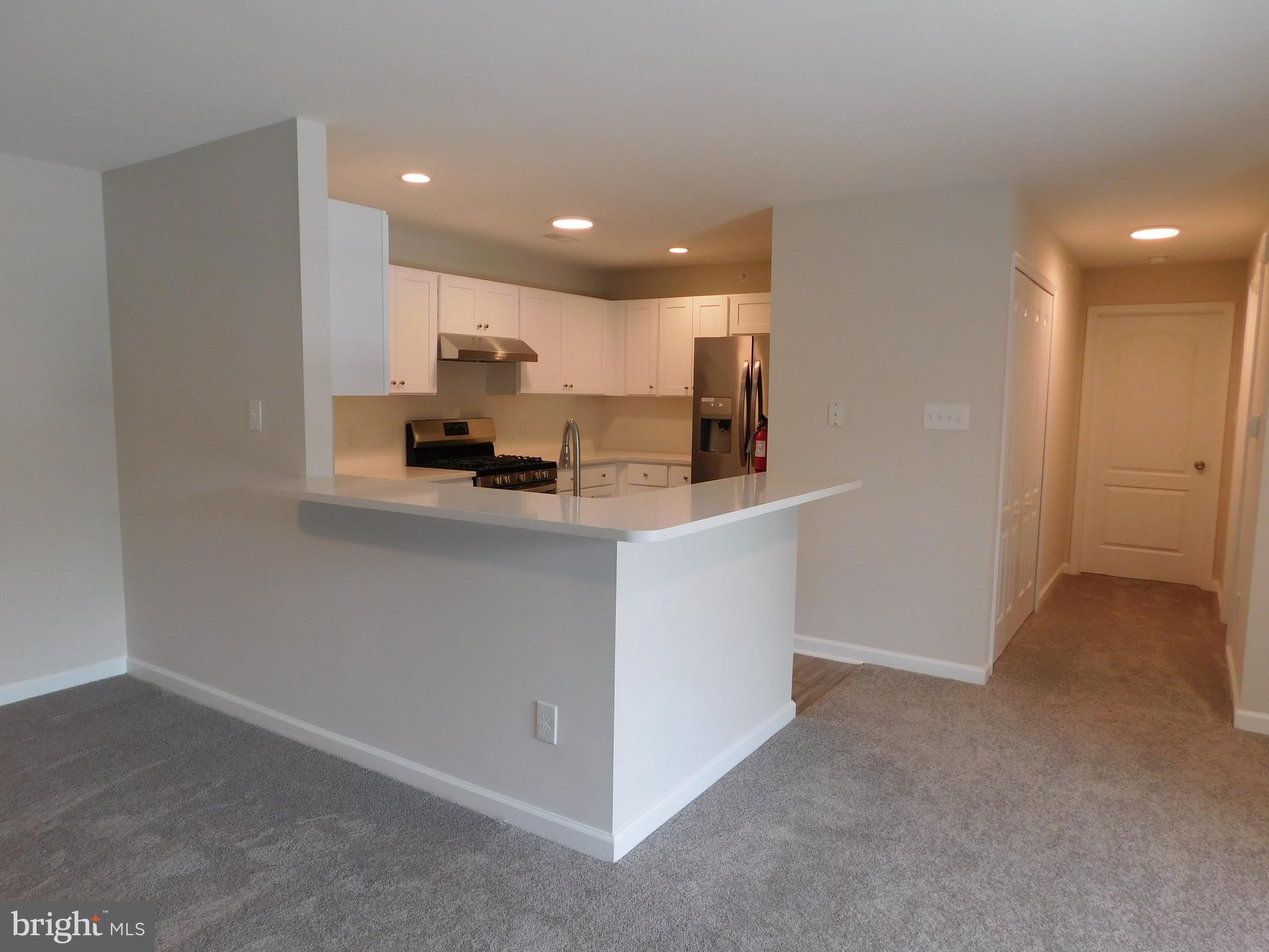 165 Natalie Road Delran, NJ 08075 - Photo 6 of 16 a view of a kitchen with kitchen island a sink a stove and a refrigerator