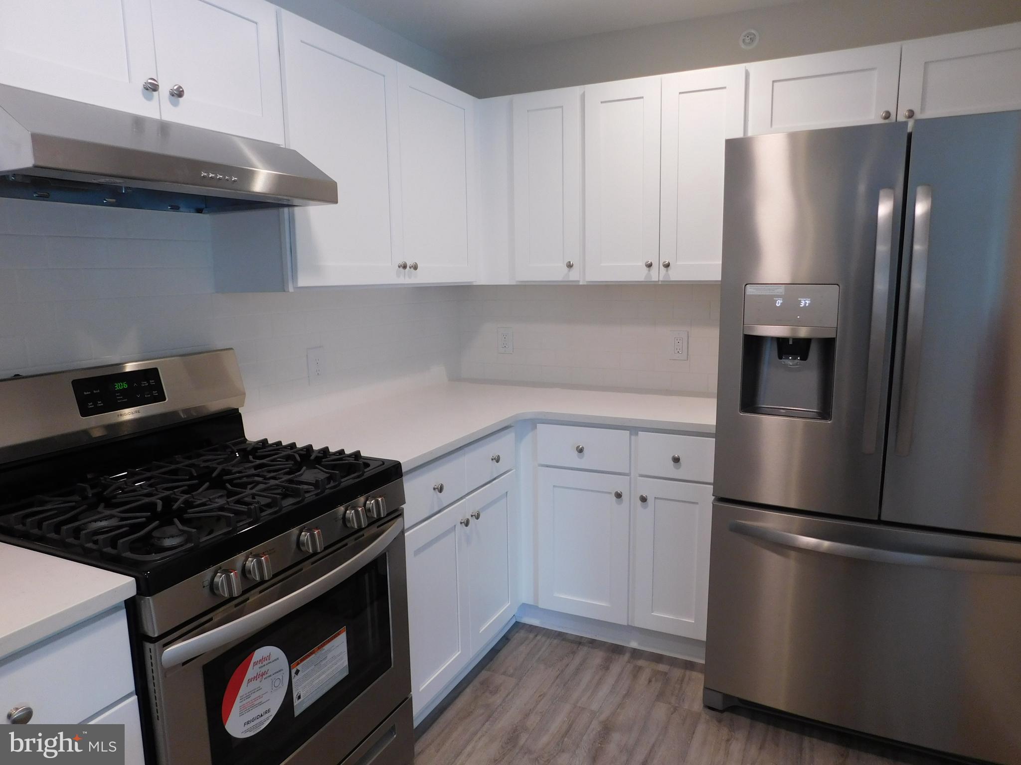 165 Natalie Road Delran, NJ 08075 - Photo 8 of 16 a kitchen with a refrigerator stove and cabinets