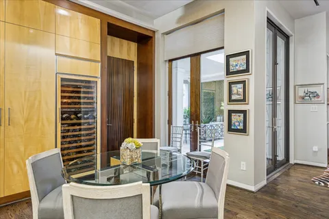 a dining room with furniture and wooden floor