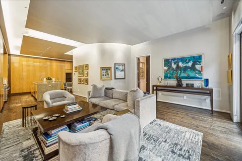 a living room with furniture and a rug