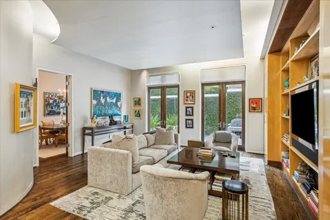 a living room with fireplace furniture and a flat screen tv