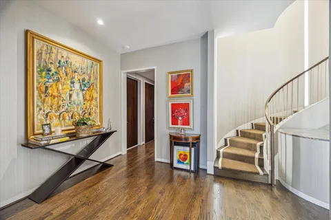 a view of entryway with stairs and wooden floor