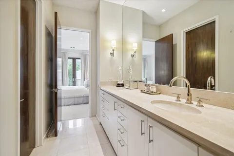 a bathroom with a double vanity sink mirror and double