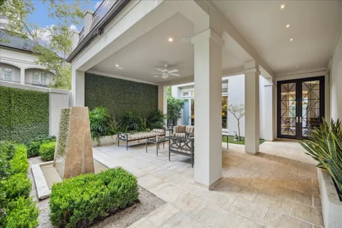 a view of a chairs and table in patio of a house