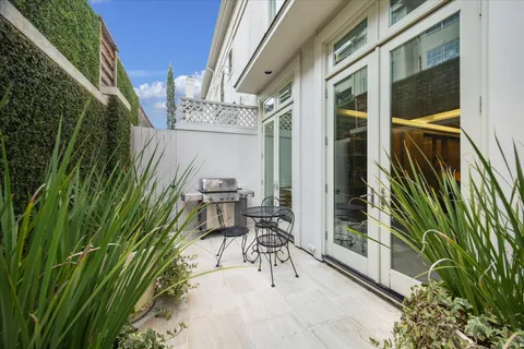 a view of balcony with furniture