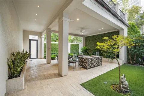 a lobby with furniture and garden view