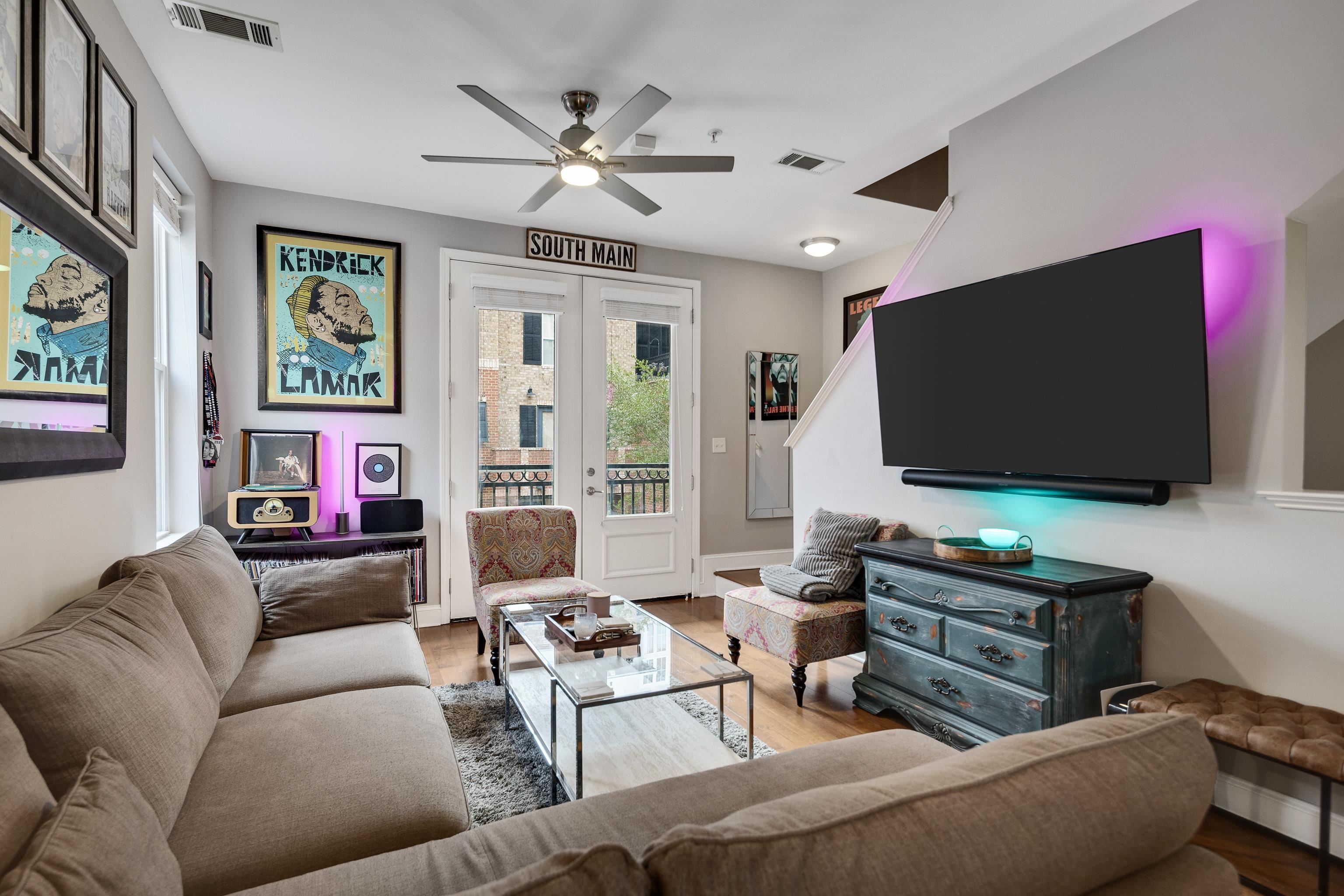 79 Shoemaker Court, Unit 108 Memphis, TN 38103 - Photo 14 of 33 a living room with furniture and a flat screen tv