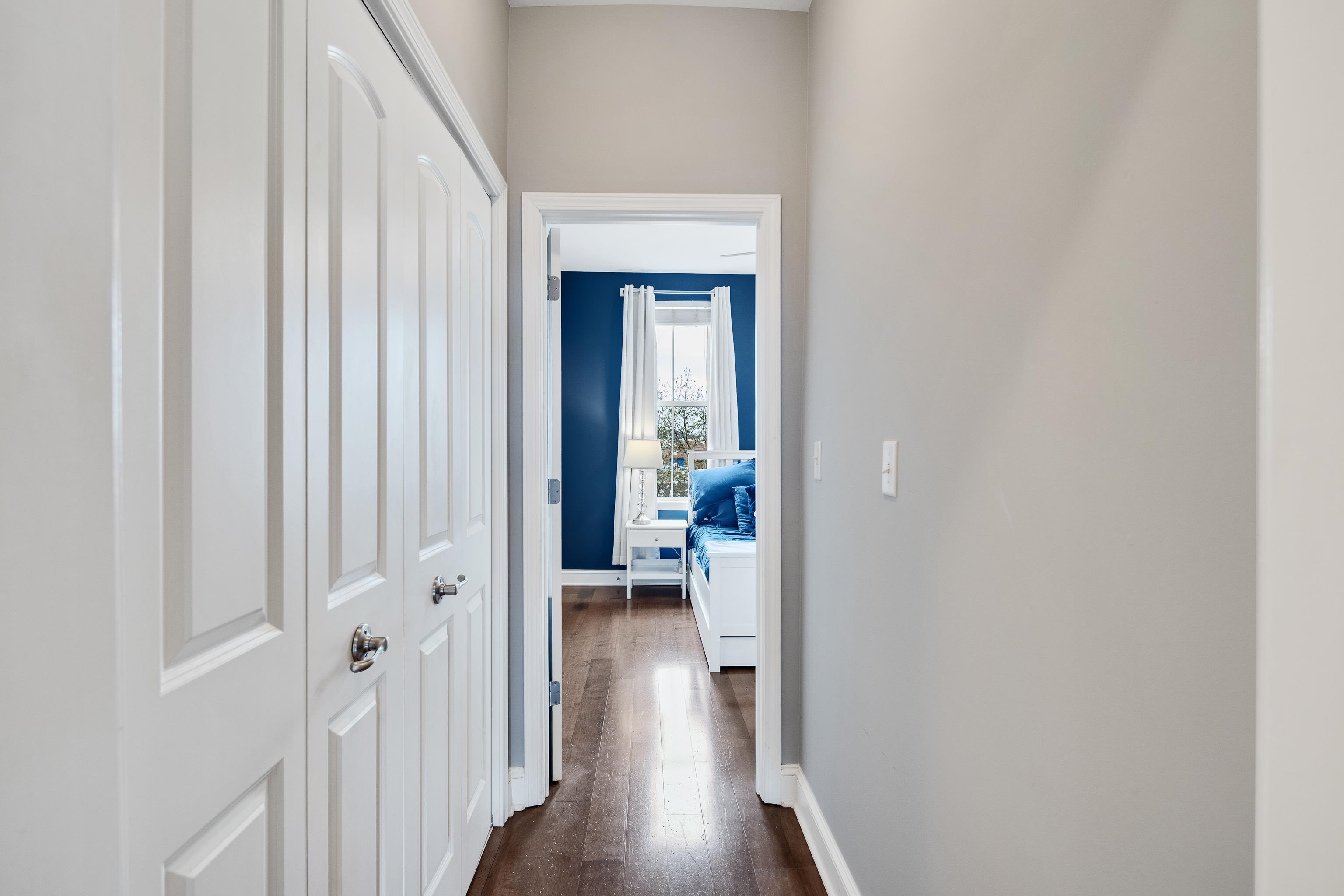 79 Shoemaker Court, Unit 108 Memphis, TN 38103 - Photo 19 of 33 a view of a hallway with wooden floor and closet