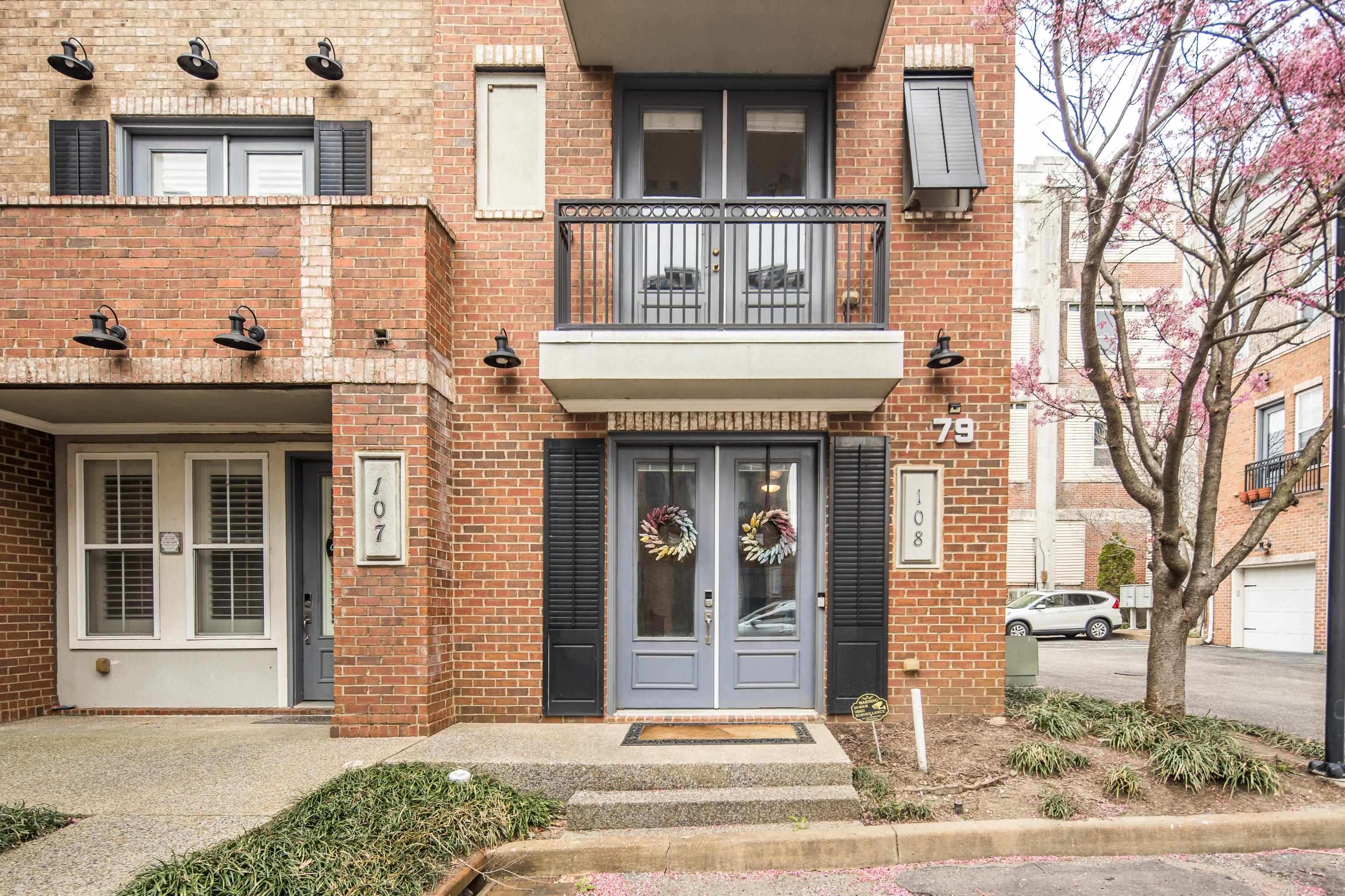 79 Shoemaker Court, Unit 108 Memphis, TN 38103 - Photo 2 of 33 a front view of a house with a yard