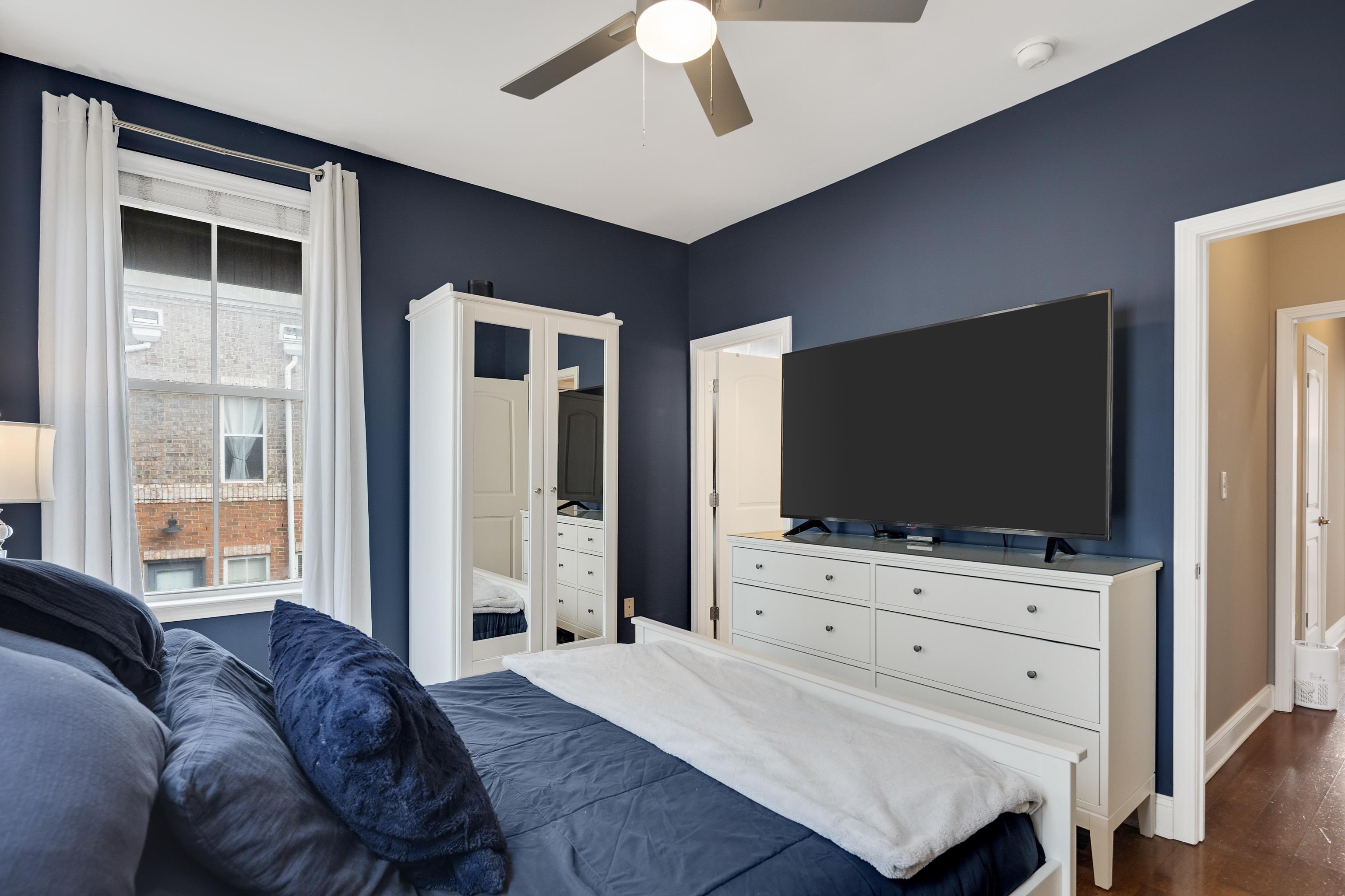 79 Shoemaker Court, Unit 108 Memphis, TN 38103 - Photo 21 of 33 a living room with furniture and a flat screen tv