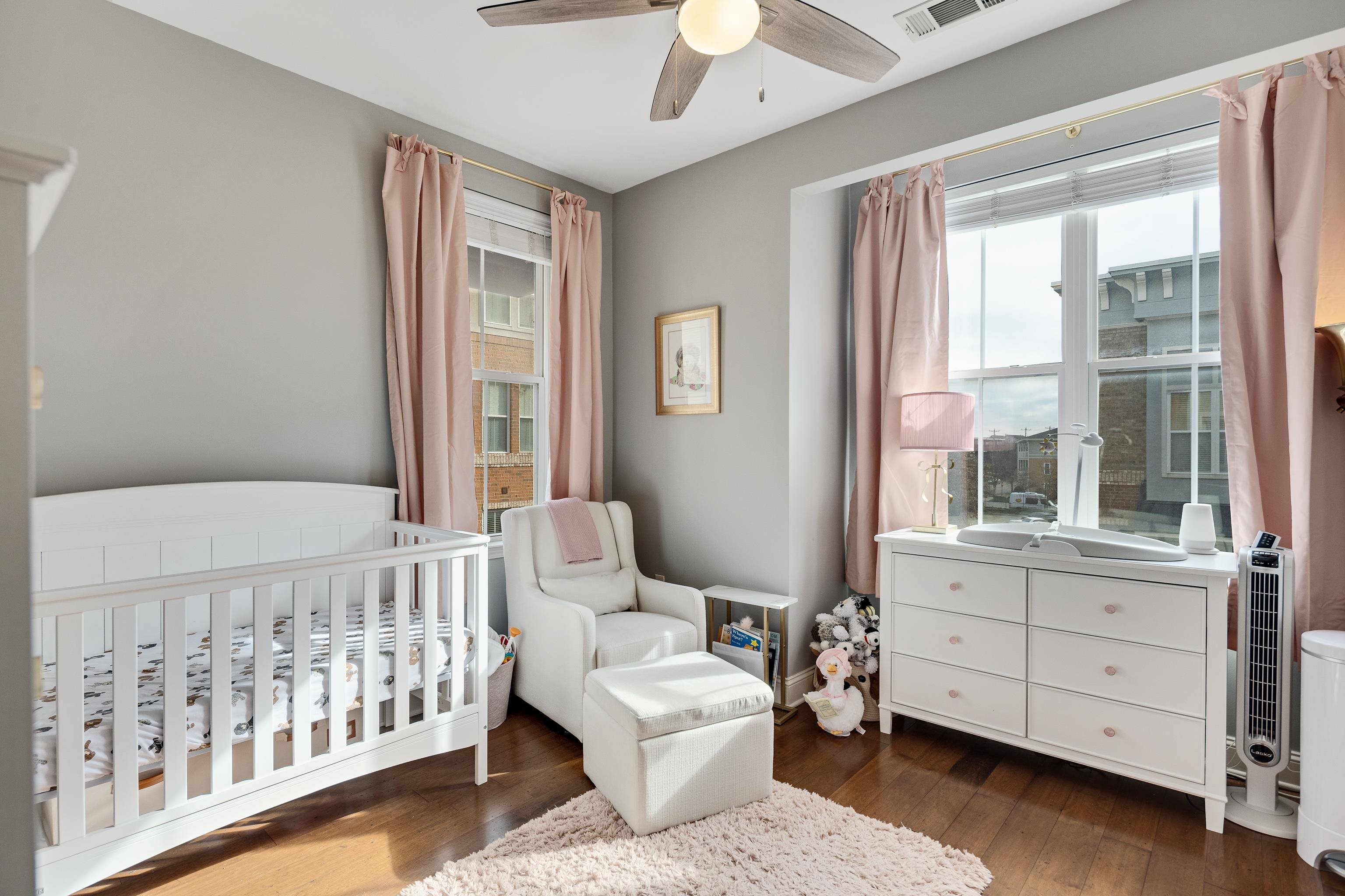 79 Shoemaker Court, Unit 108 Memphis, TN 38103 - Photo 24 of 33 a bedroom with furniture and windows