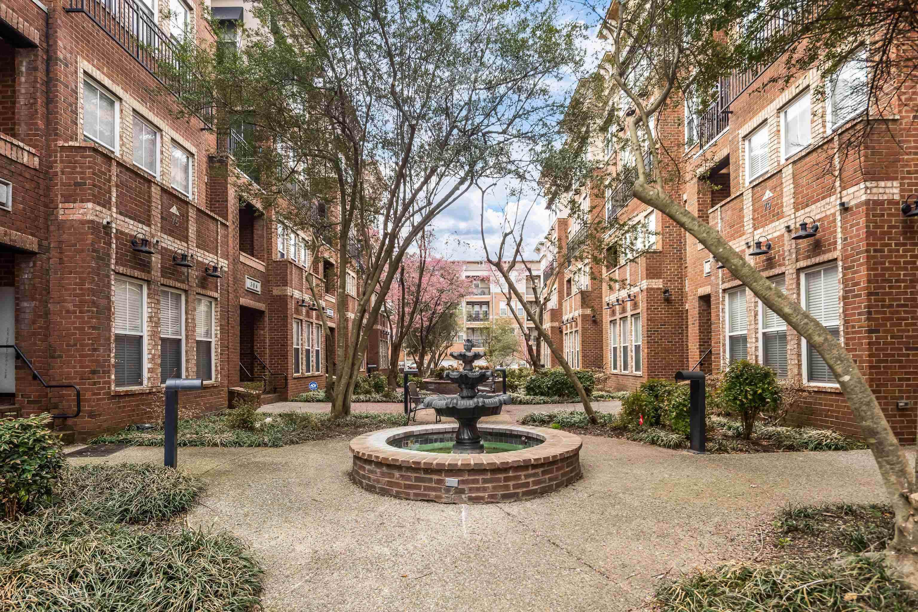 79 Shoemaker Court, Unit 108 Memphis, TN 38103 - Photo 28 of 33 a front view of a building with yard
