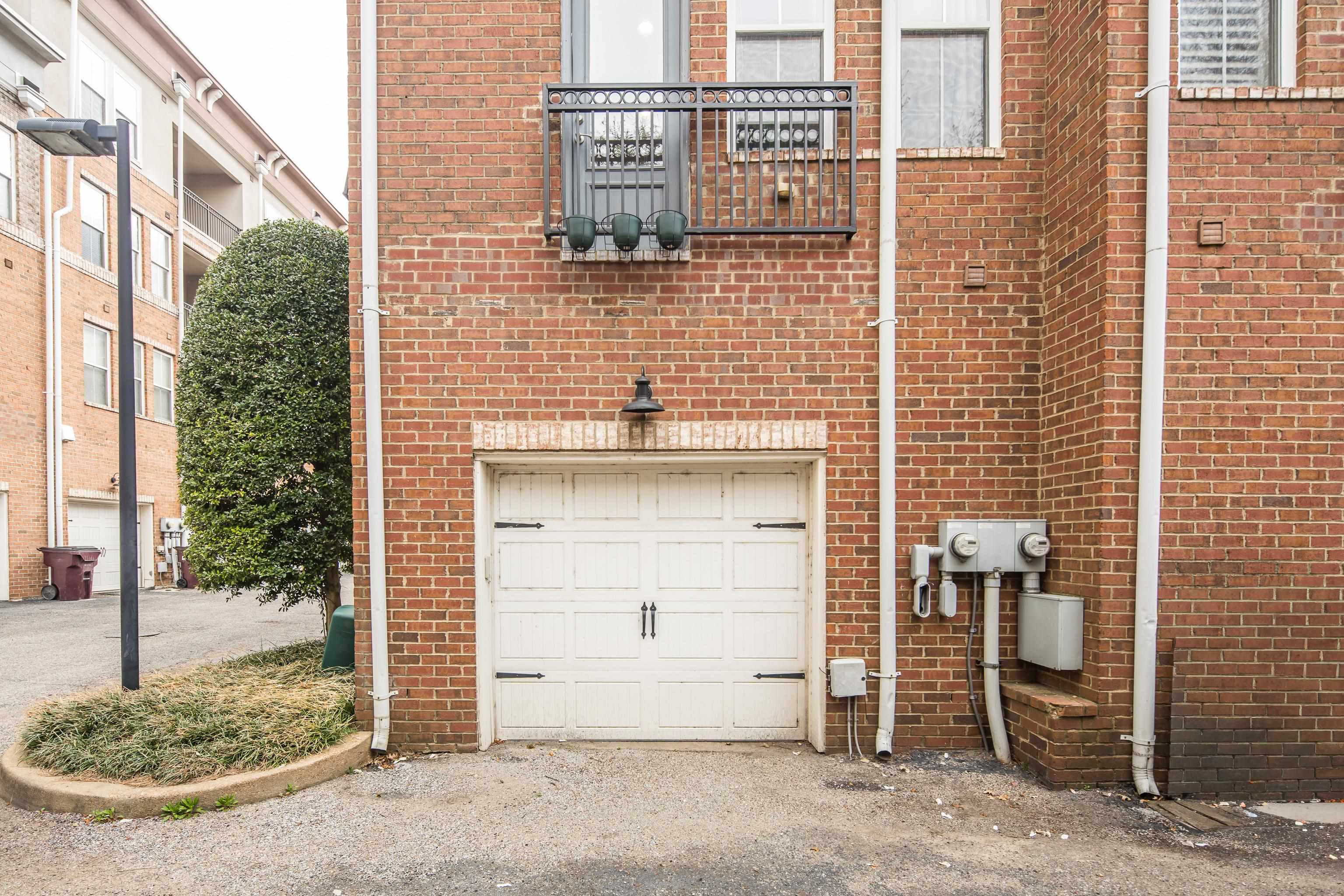 79 Shoemaker Court, Unit 108 Memphis, TN 38103 - Photo 32 of 33 a bathroom with a sink and a mirror