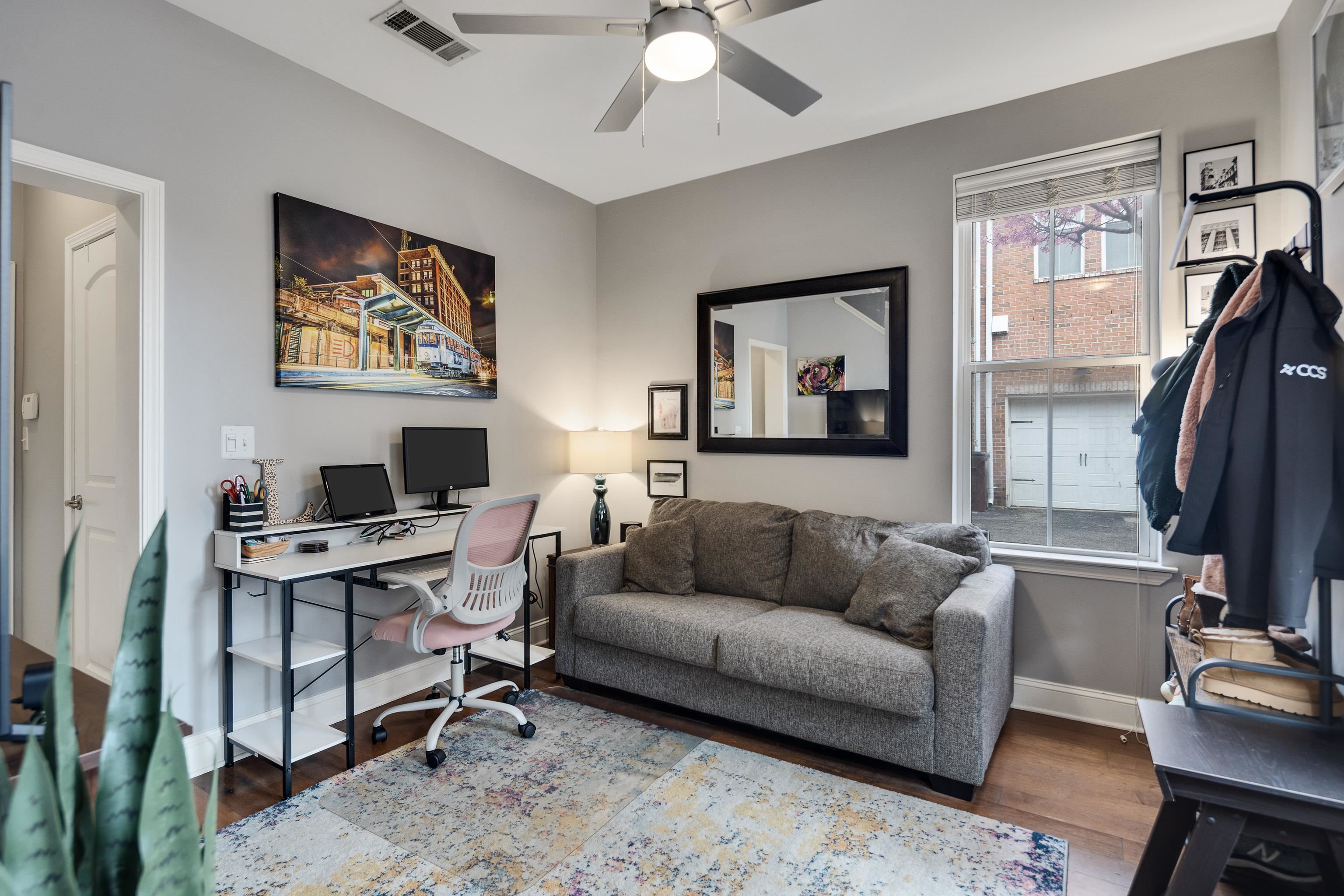 79 Shoemaker Court, Unit 108 Memphis, TN 38103 - Photo 4 of 33 a living room with furniture and a flat screen tv