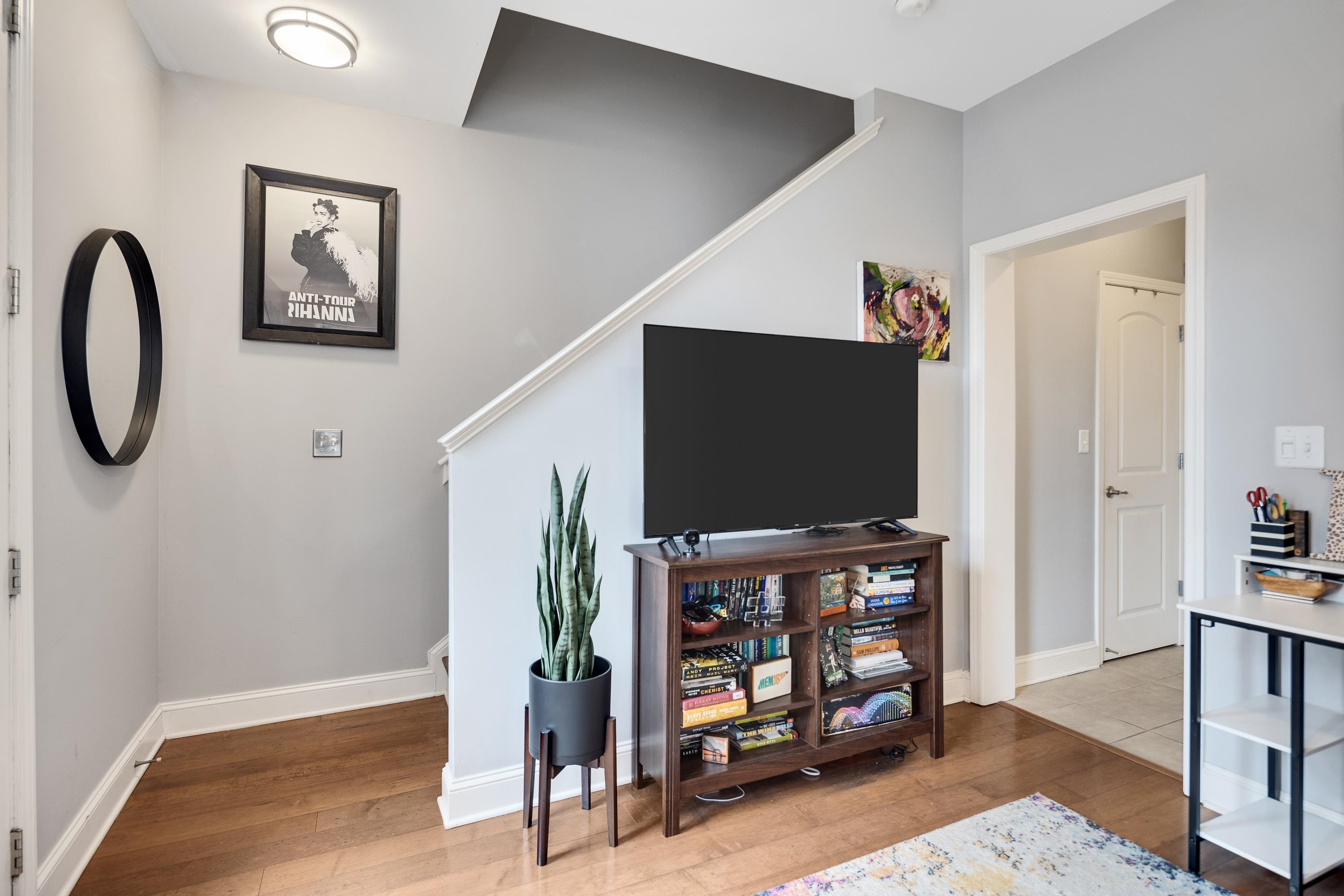 79 Shoemaker Court, Unit 108 Memphis, TN 38103 - Photo 5 of 33 a living room with furniture and a flat screen tv