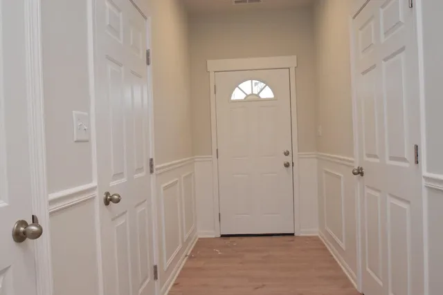 a view of a livingroom from a hallway