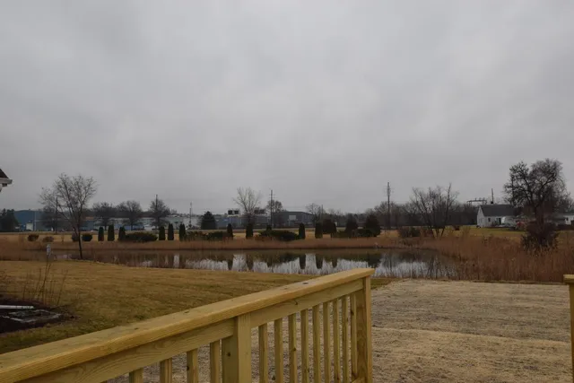 a view of swimming pool next to a lake view