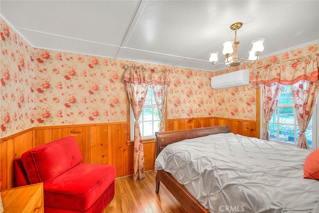 5926 Pine Street Wrightwood, CA 92397 - Photo 15 of 66 a bedroom with a bed and window